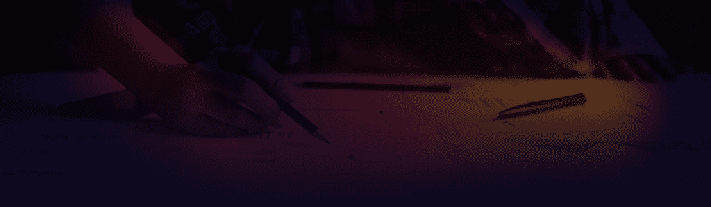 Gradient overlay on top of a person writing on some papers with various graphs.